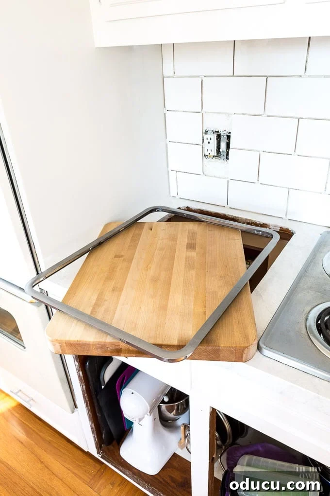 How One Reader Sparked My Kitchen Transformation 3 Butcher block cutting board in set in kitchen counter with stainless steel friend.