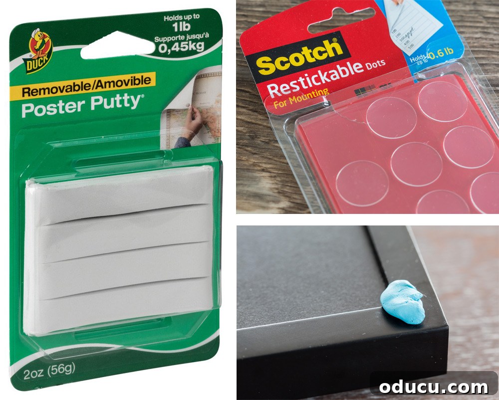 Close-up showing poster putty used as a secret trick to perfectly hang a grid style gallery wall and keep frames level.