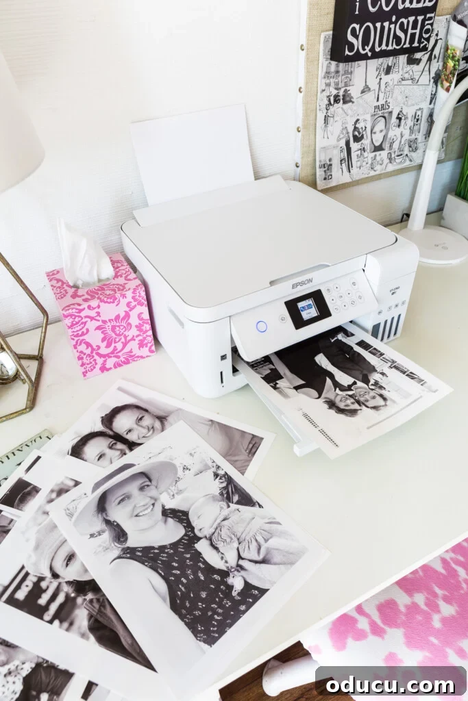 Epson Eco Tank 2760 Printer on a desk in a home studio or office environment.