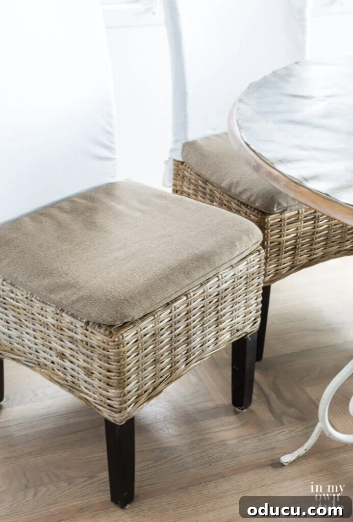 Awaken Your Home For Spring 17 Driftwood colored rattan dining chair covers made by repurposing an item that was broken and headed for the trash.