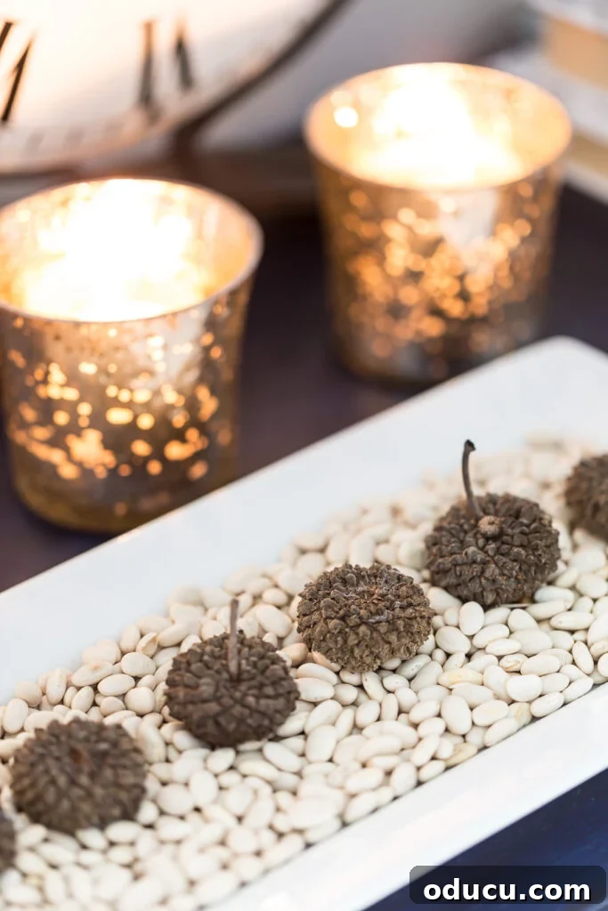 Tray Chic: Stylish Solutions for Every Corner 7 Nature inspired fall decor. Acorns on a tray of white beans.