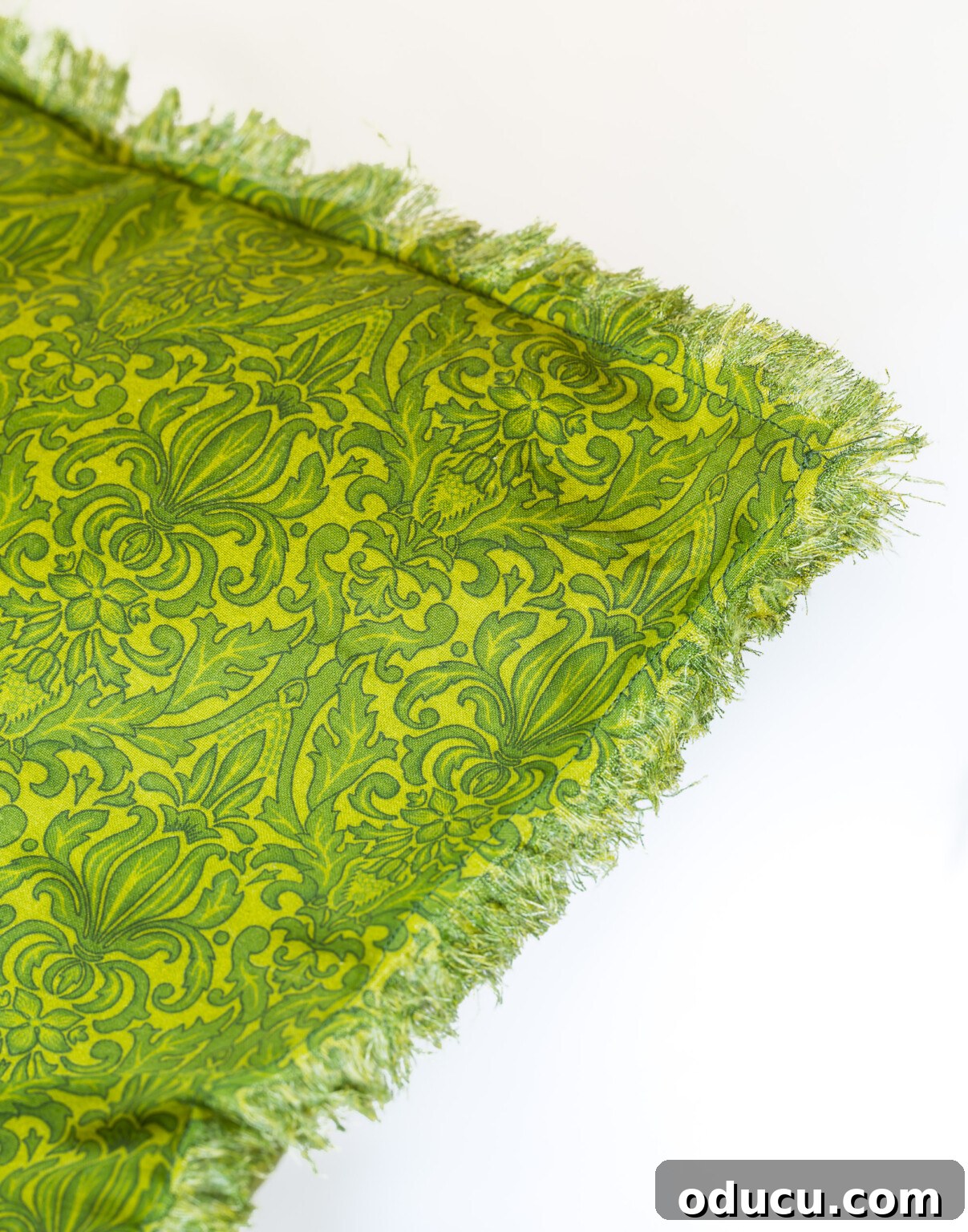 How to fringe cut fabric to make a pretty fringed edge pillow cover, even with tight weaves.