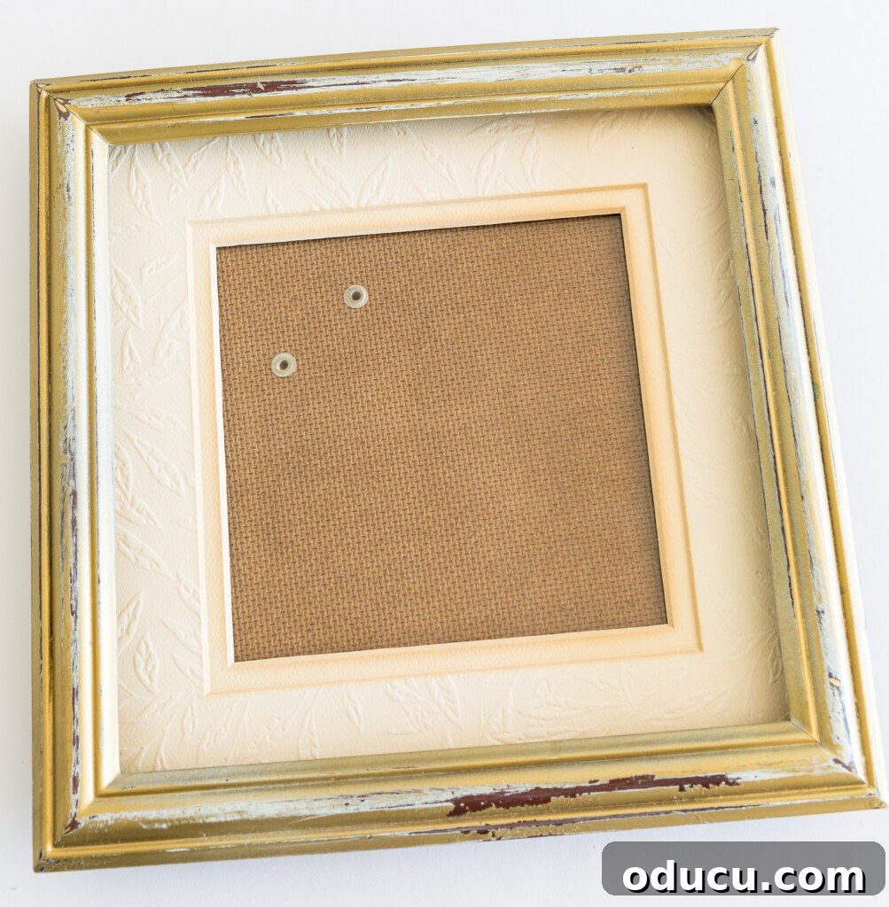 Give Your Phone Photos a Ribbony Edge 3 Old gold painted photo frame before makeover showing its outdated style