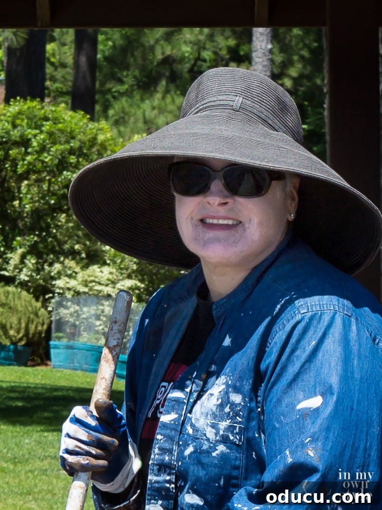 A Personal Reckoning 4 Closeup photo of Blogger In My Own Style wearing a large brim black hat to protect her Vitiligo from the sun.