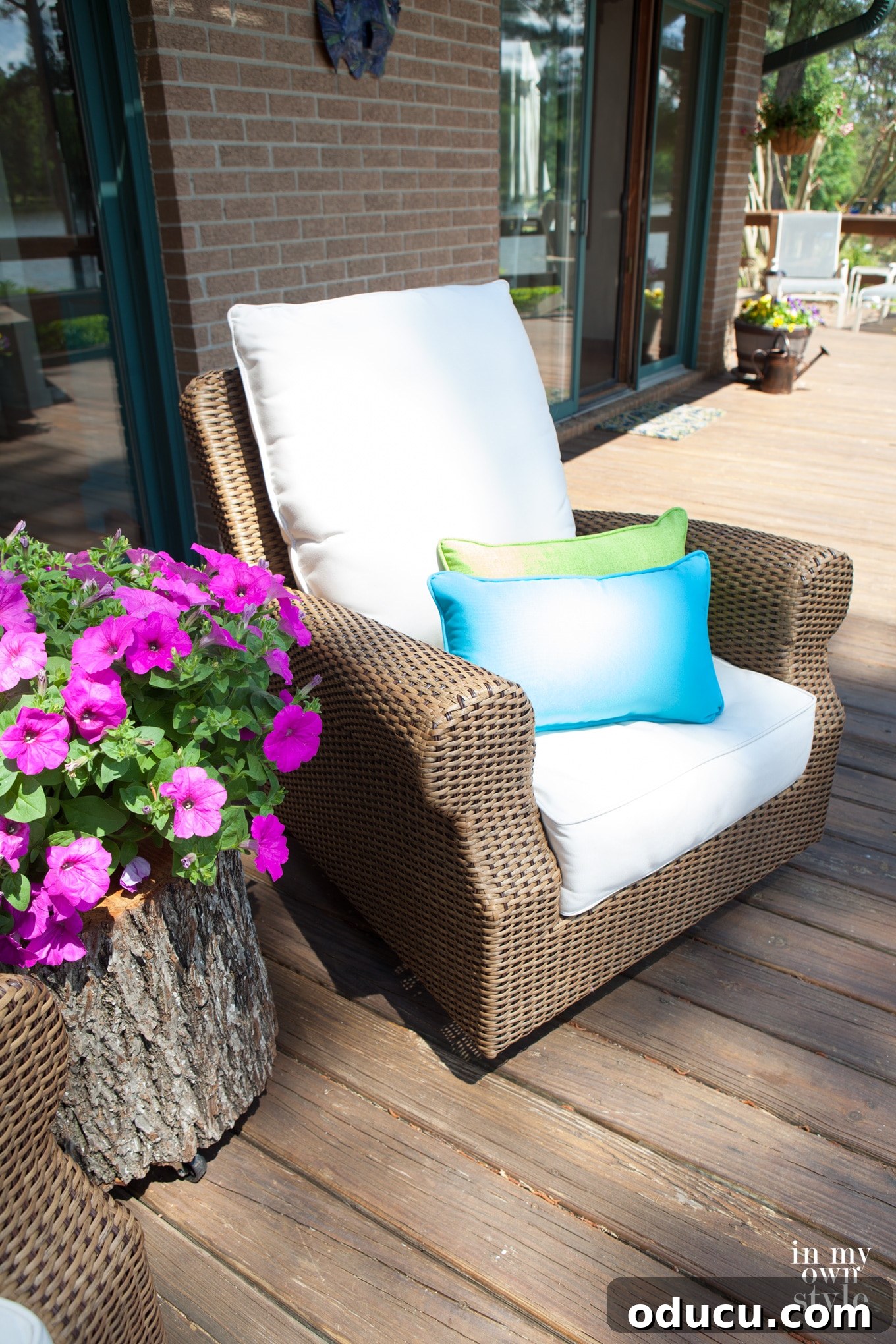Craft a Unique Tree Trunk Outdoor Table 5 Rustic outdoor table made from a tree trunk, adorned with a vibrant pot of flowers, ready for use.