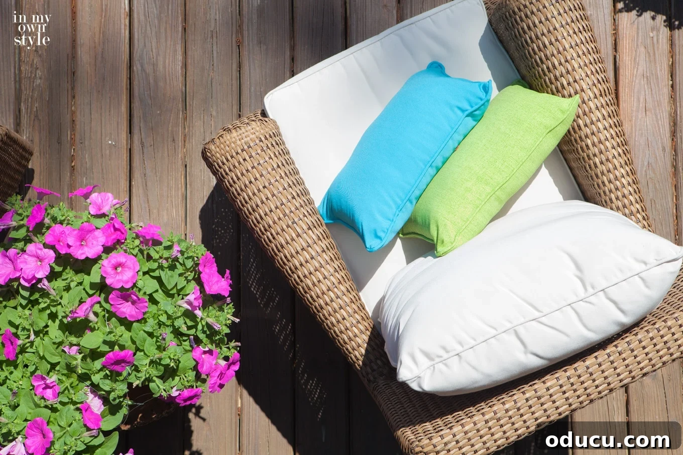 Craft a Unique Tree Trunk Outdoor Table 7 Deck decorated with an outdoor tree trunk table, outdoor rugs, and potted plants, creating a cozy outdoor living space.