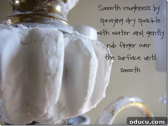 Pressing a hot glue stick to create ridges in Spackle