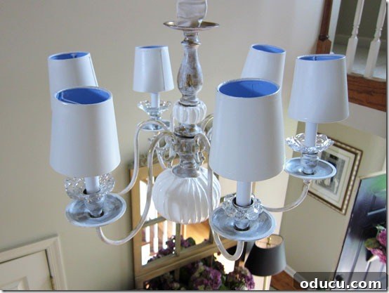 Applying gloss white paint to the Spackled chandelier