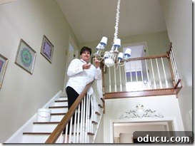 DIYer Diane working on the chandelier makeover