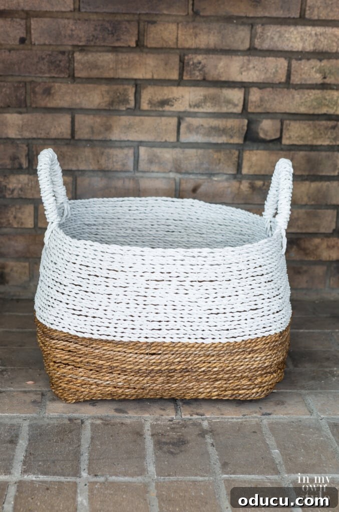 Statement Decor: Creative Ways with Large Baskets 2 Elegant large white and natural woven basket from Target positioned in an empty fireplace, ready for seasonal decor.