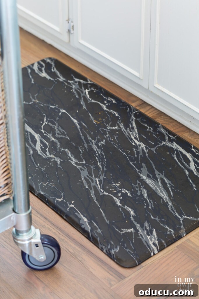 Effortless Summer Style 17 Black marble gel mat on Bona Flooring grey stained hardwood floor.