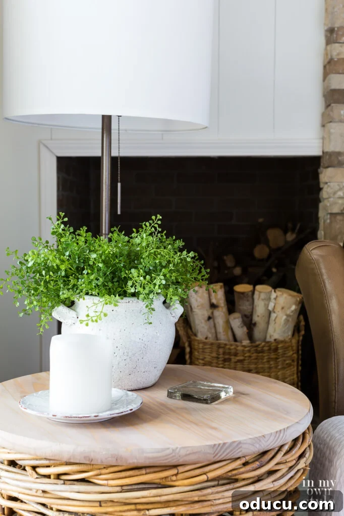 Transform Your Wicker Basket into a Stylish Side Table 11 Finished wicker basket side table in a living room corner, next to a comfy chair.