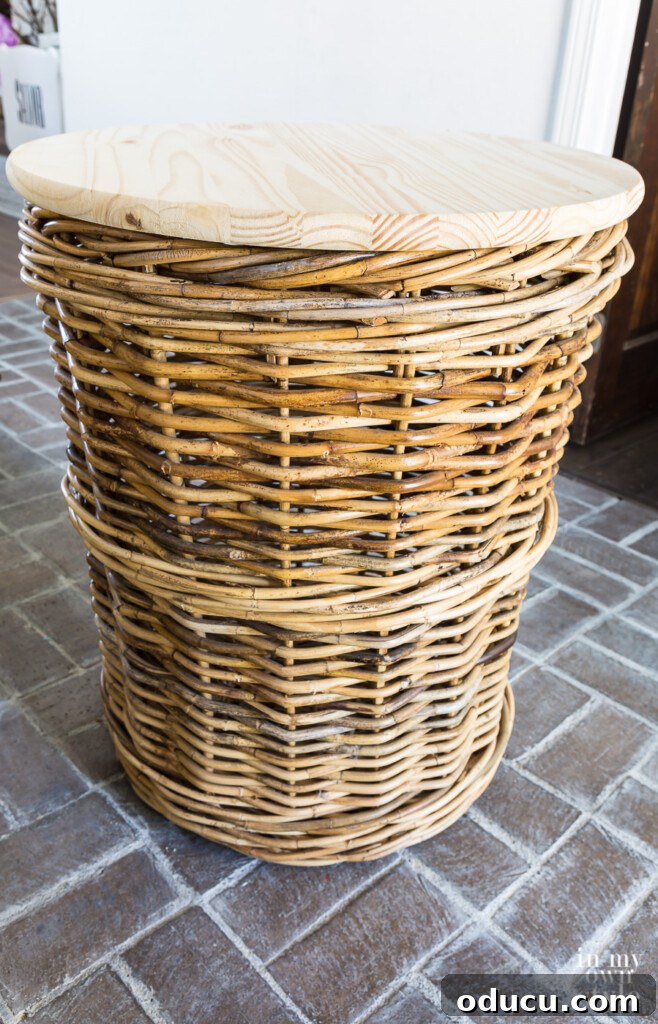 Transform Your Wicker Basket into a Stylish Side Table 7 Side table idea: Wicker basket with round wood top on it, showcasing the finished DIY project.
