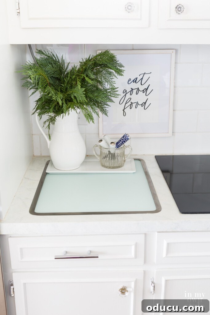 My Kitchen's Muse: Tools That Ignite Culinary Desire 3 Vance Industries Surface Saver in counter glass cutting board. Framed art on wall says eat good food.