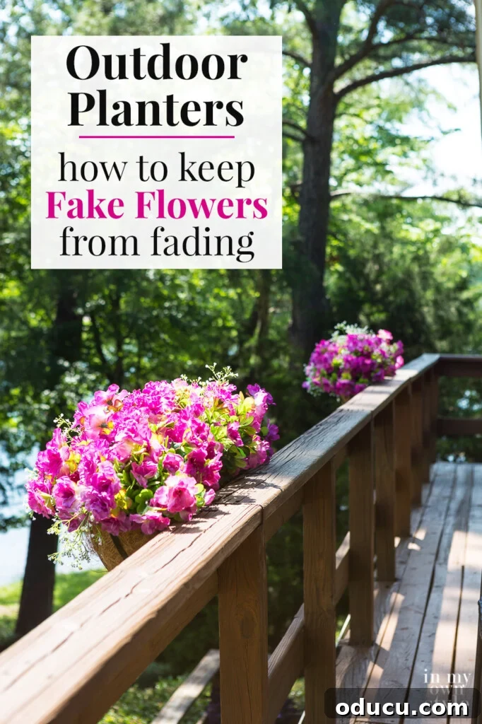 Lakeside Deck Rail Planter Boxes 18 Pink Flower filled deck railing planters along deck. Text overlay says Outdoor Planters how to keep Fake Flowers from fading.