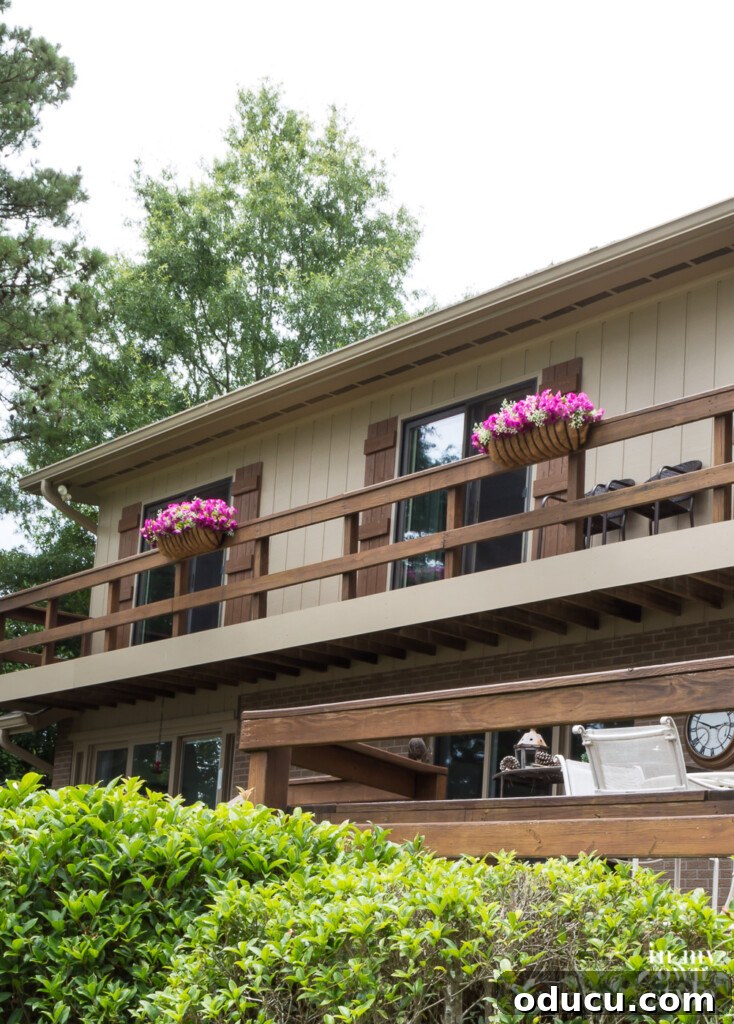 Lakeside Deck Rail Planter Boxes 7 Window box flower arrangements in English horse trough planters.
