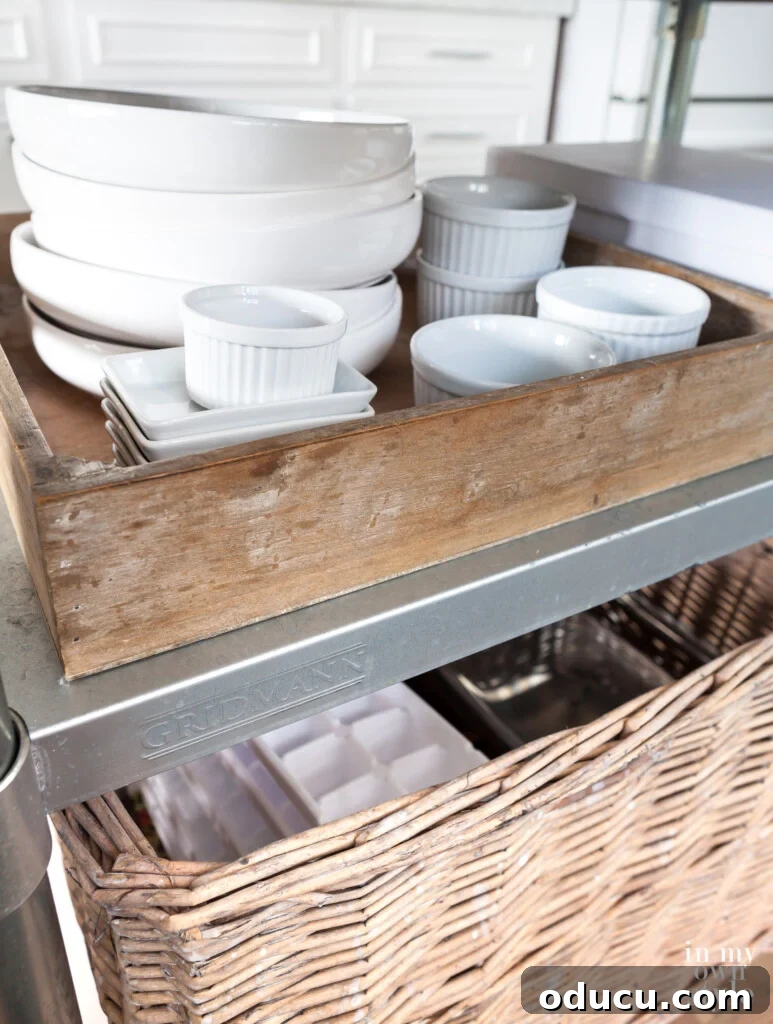 Cultivating Your Creative Sanctuary 8 White plates, bowls and ramekins in a wood box on kitchen cart island, organized for easy access.