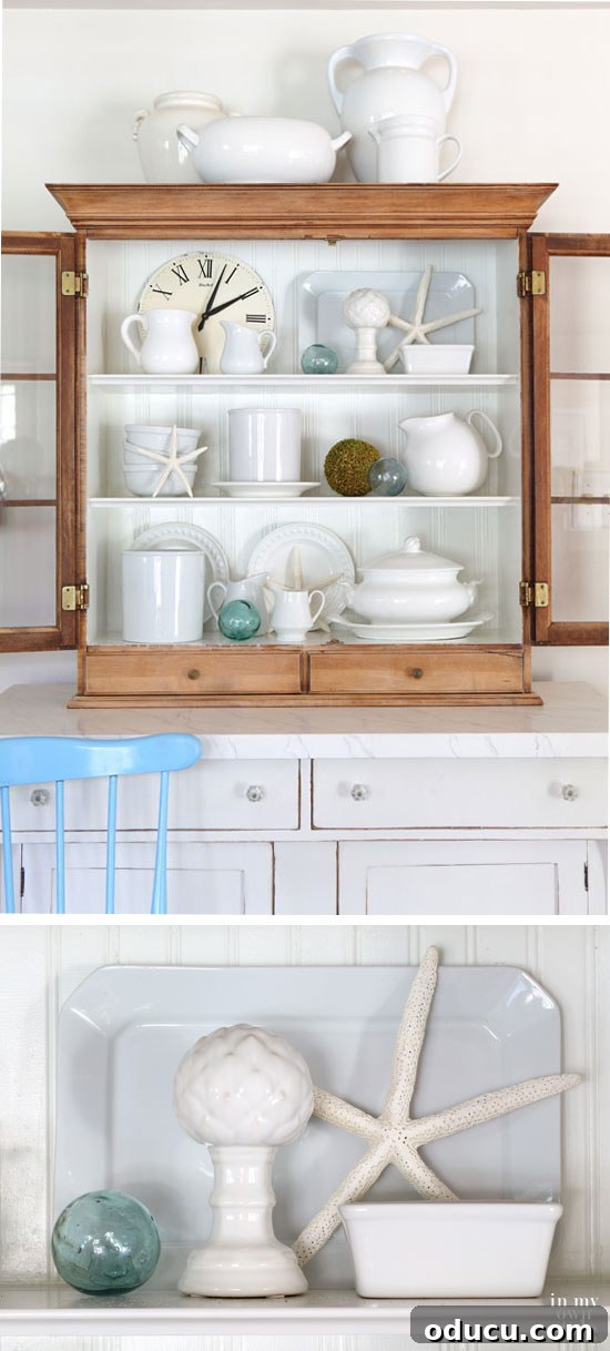 Instant Summer Room Makeover 3 A curated display of simple summer decorating ideas on an open shelf, featuring vacation souvenirs and natural elements.