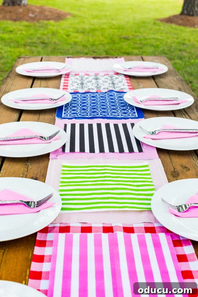 The Art of Decorating with Paper Napkins 4 A vibrant, patterned paper napkin runner elegantly laid out on a rustic wood picnic table on a lush lawn.