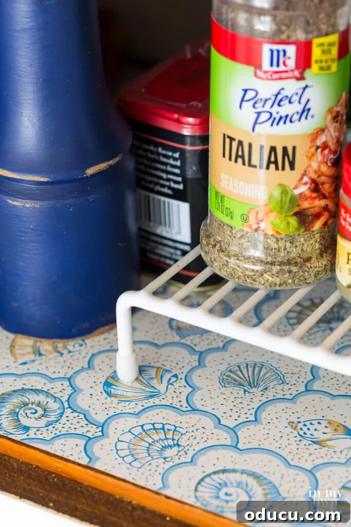 Brighten Your Kitchen with DIY Colorful Cabinet Liners 2 Old vinyl Contact brand shell motif adhesive shelf liner.