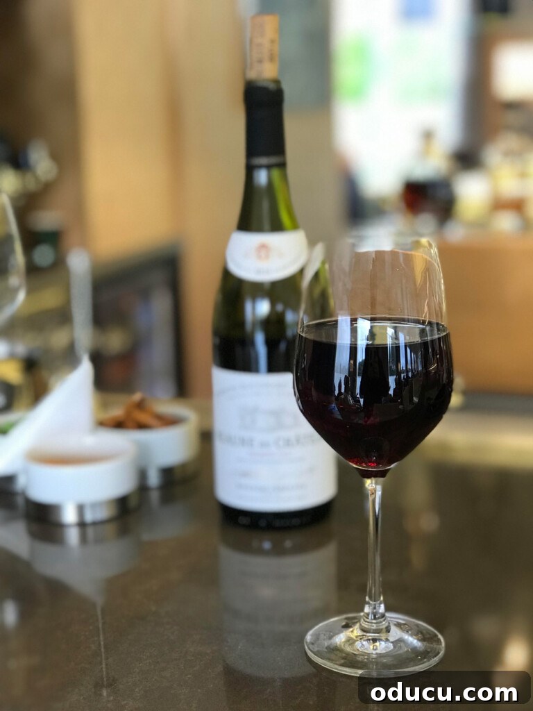 Autumn Decor Prep 7 glass of red wine on counter with bottle behind it