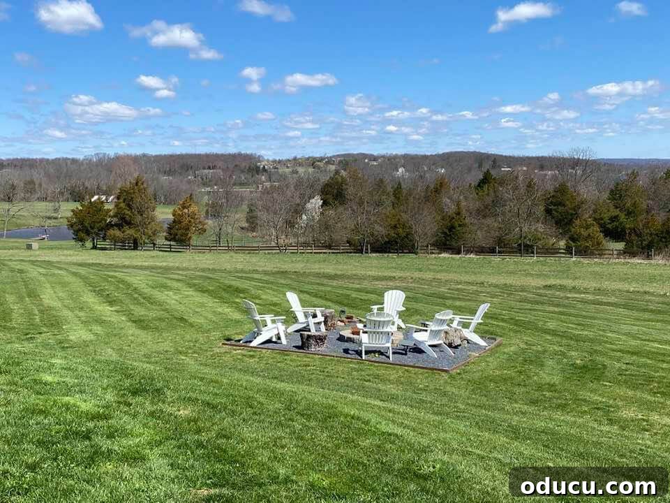 Ranch Renaissance: Modern Farmhouse Transformation 16 firepit in large yard with sweeping view of the landscape