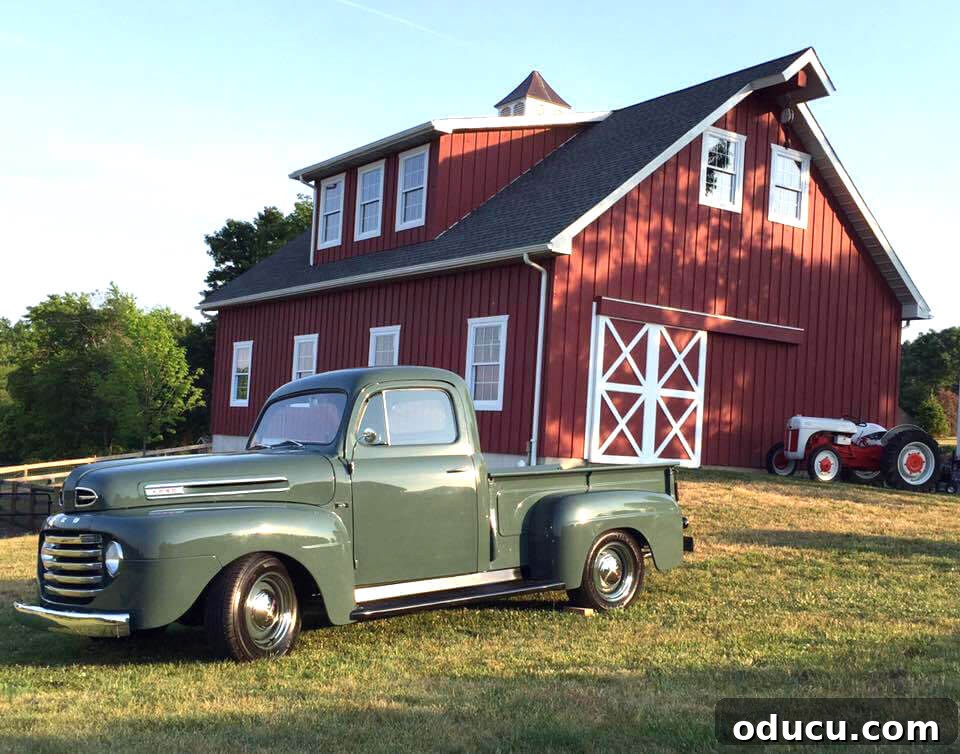 Ranch Renaissance: Modern Farmhouse Transformation 26 green-vintage-truck-in-front-of-barn adding rustic charm
