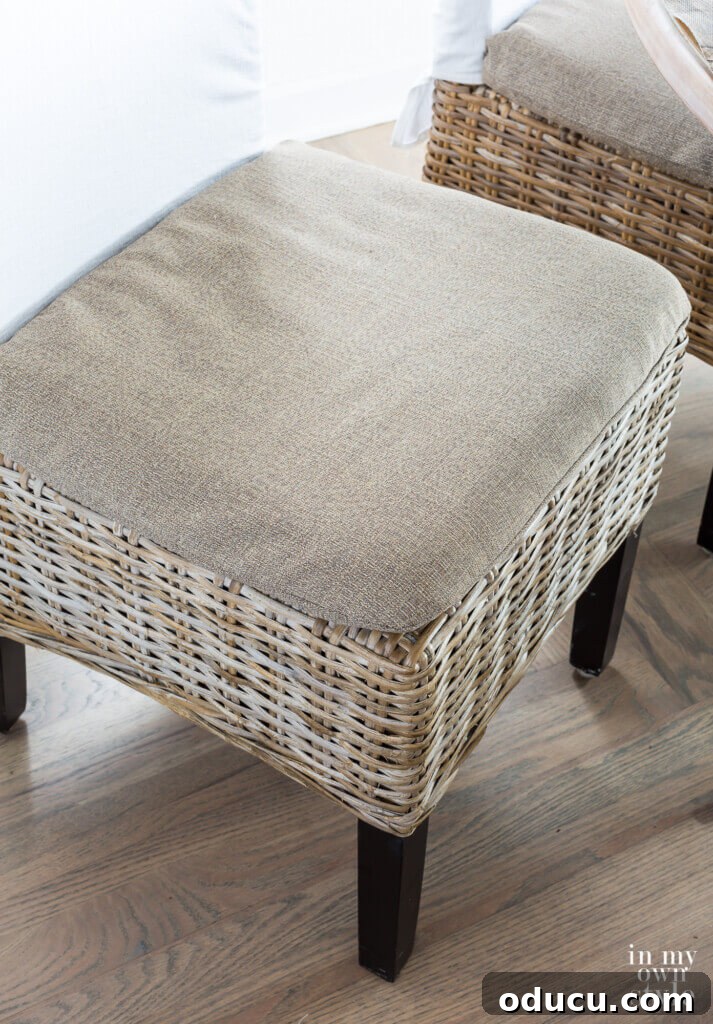 Score Free Fabric for Stunning Home Decor 6 Driftwood-colored rattan dining chair covers crafted by repurposing fabric from a broken item, showcasing clever budget decorating.