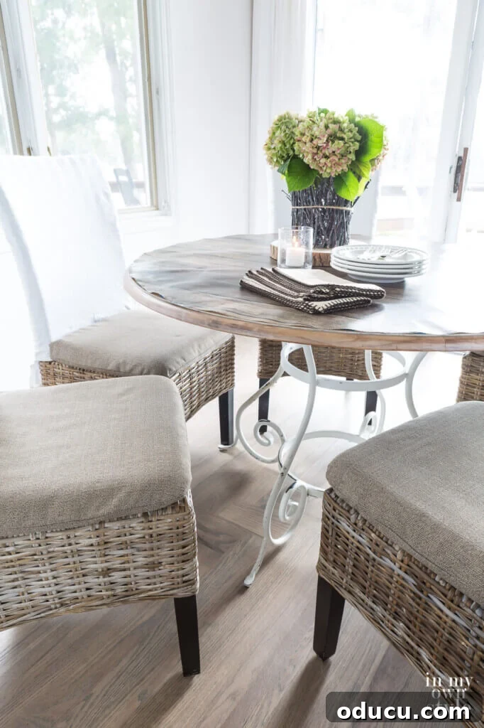 Score Free Fabric for Stunning Home Decor 7 Close-up image of newly made dining chair cushion covers, expertly crafted from repurposed fabric of a broken outdoor umbrella.