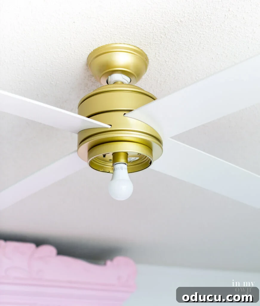 Ceiling Fan Globe Upgrade Choices 3 Close-up view of the Hunter Hepburn ceiling fan without its glass globe, exposing the light bulb.