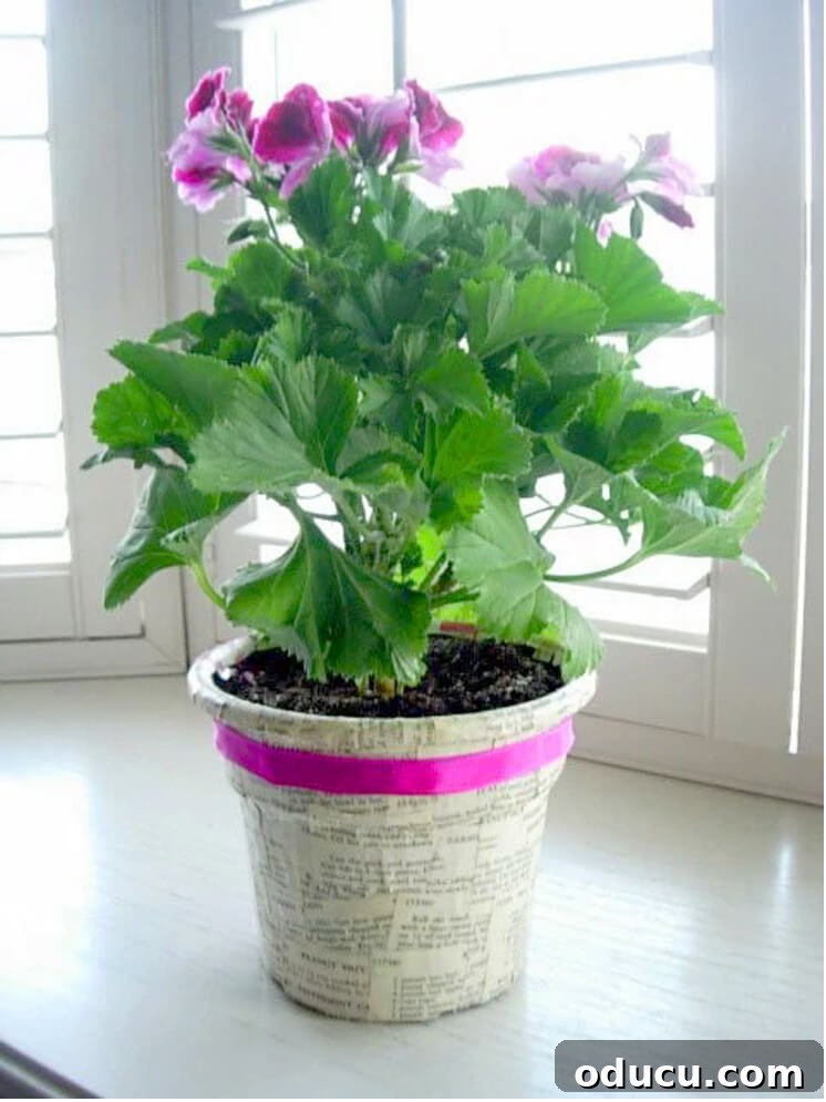 Upcycle Household Items for Breathtaking Decor 5 decorating a plastic planter with book pages