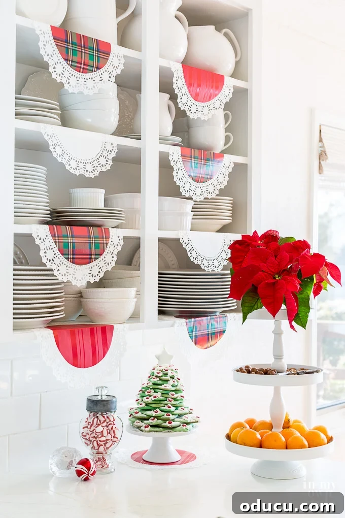 Crafting a Dual-Level Kitchen Storage Stand 3 Christmas kitchen decorating ideas on a dime. A 3-tier stand decorated with Christmas ornaments and greenery.
