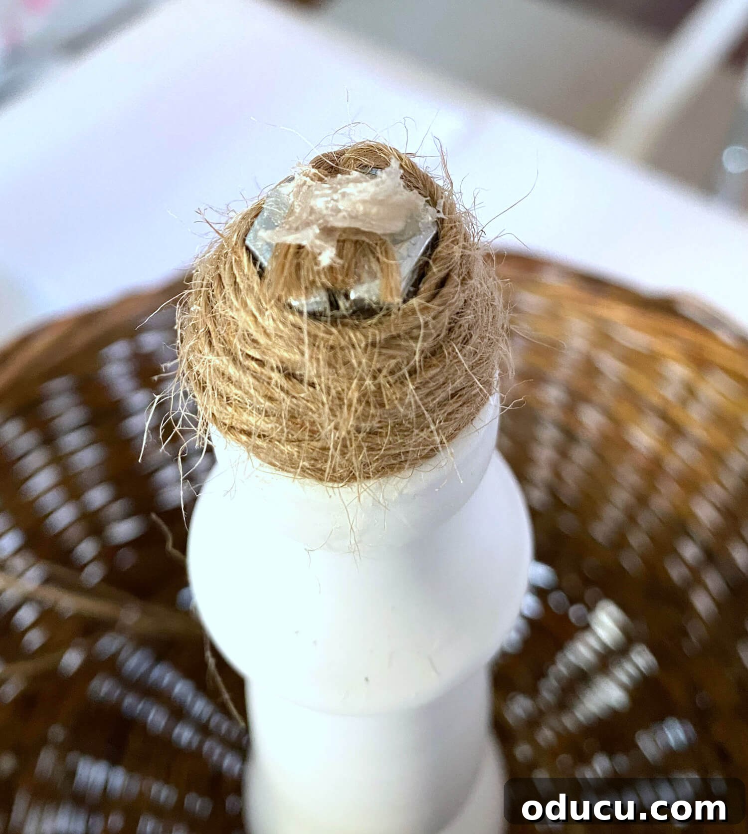 Crafting a Dual-Level Kitchen Storage Stand 10 Twine wrapped around top of newly reassembled 2 tier stand with hot glue on top. The top of the stand with twine secured by a dot of hot glue.