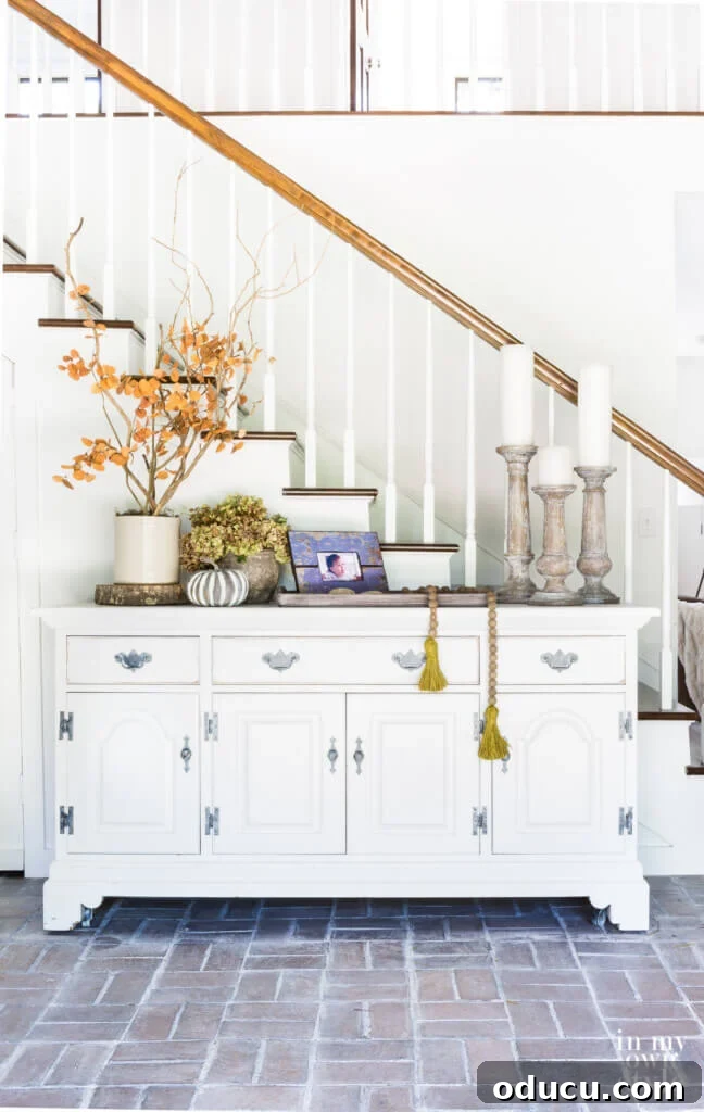 Entryway Upgrade: The Dresser Solution 11 Entryway fall decorating ideas using a repurposed white dresser and natural elements.