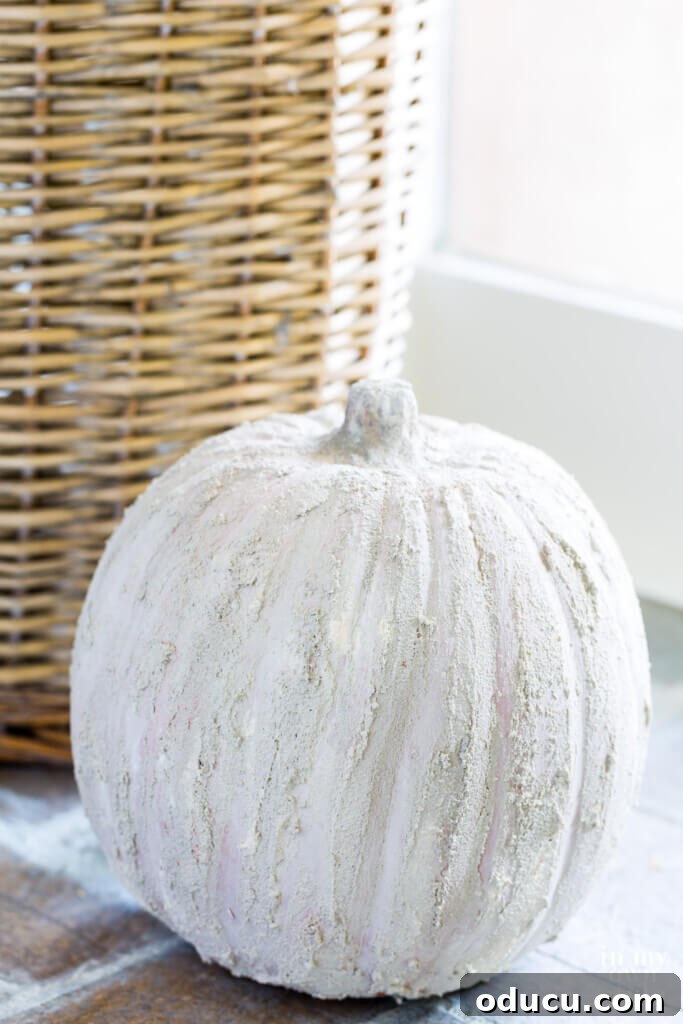 Entryway Upgrade: The Dresser Solution 16 Tall handled basket with stone pumpkin in front of it, showing DIY transformation.
