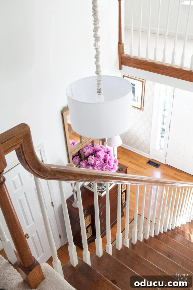 Entryway Upgrade: The Dresser Solution 4 Affordable foyer lighting tips and small blue sideboard.