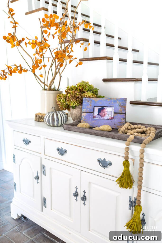 Entryway Upgrade: The Dresser Solution 7 Fall decorating on an entryway sideboard using natural elements.