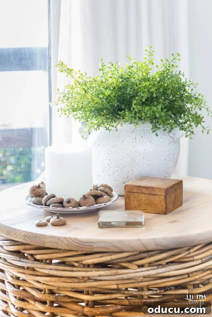 Autumn's Embrace: Natural Decor for Your Living Space 11 Round wicker table with fall decor in the colors green and white.
