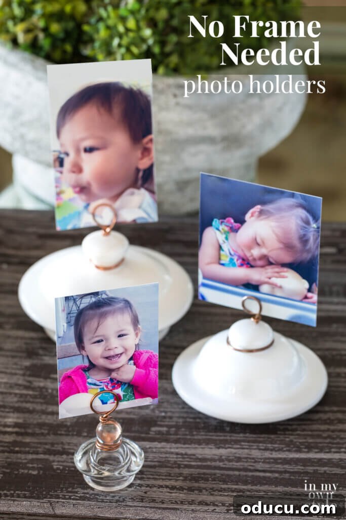 A final, captivating display of three artfully arranged lid photo holders, fashioned from upcycled teapot and jar lids, proudly showcasing cherished photos on a stylish surface. The accompanying text emphasizes 'No Frame Needed photo holders'.