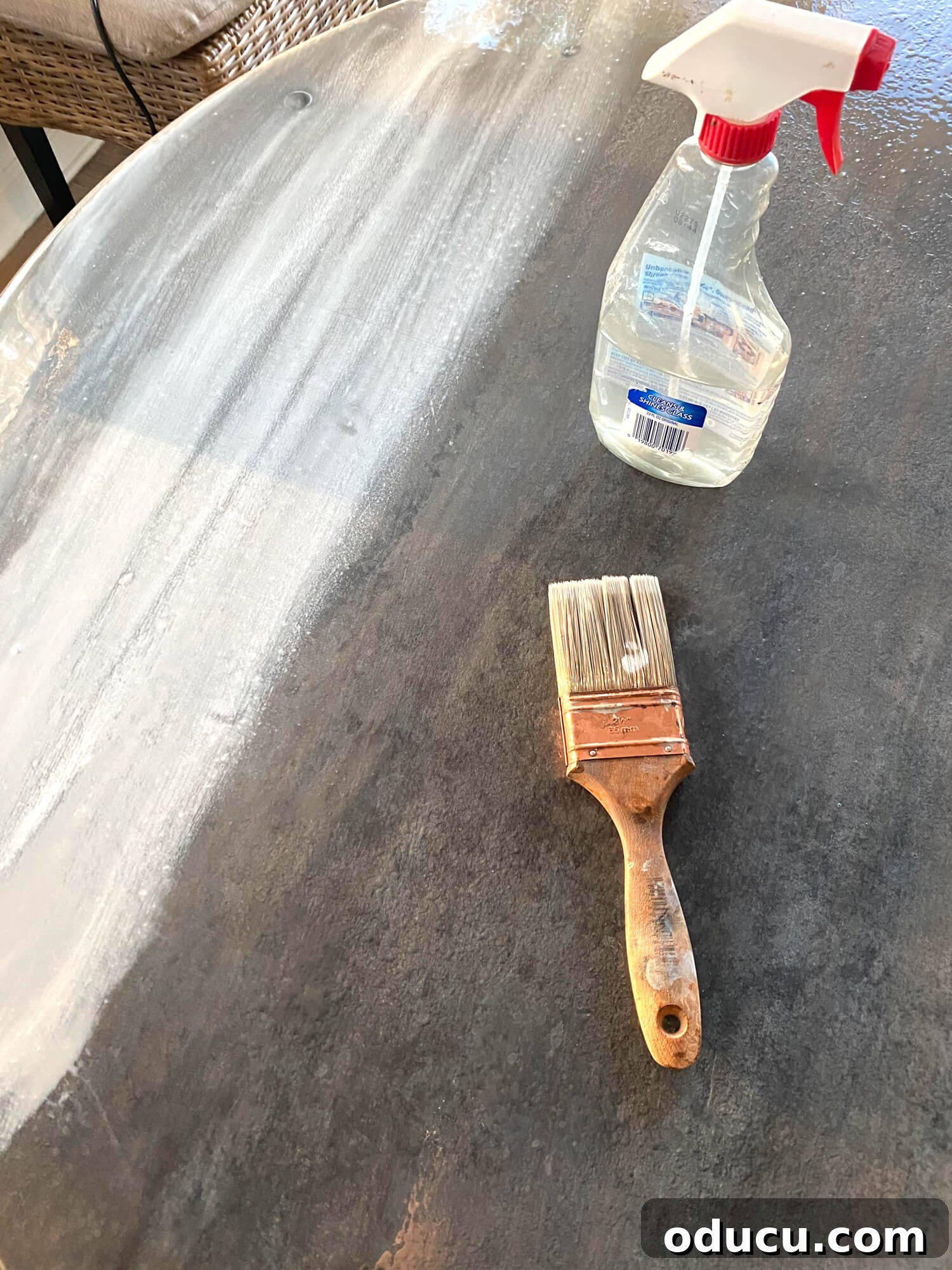 A detailed step-by-step image demonstrating how to layer paint with mineral spirits to achieve a slate-like or zinc-like appearance on wood. The process involves creating subtle textures and blending techniques.