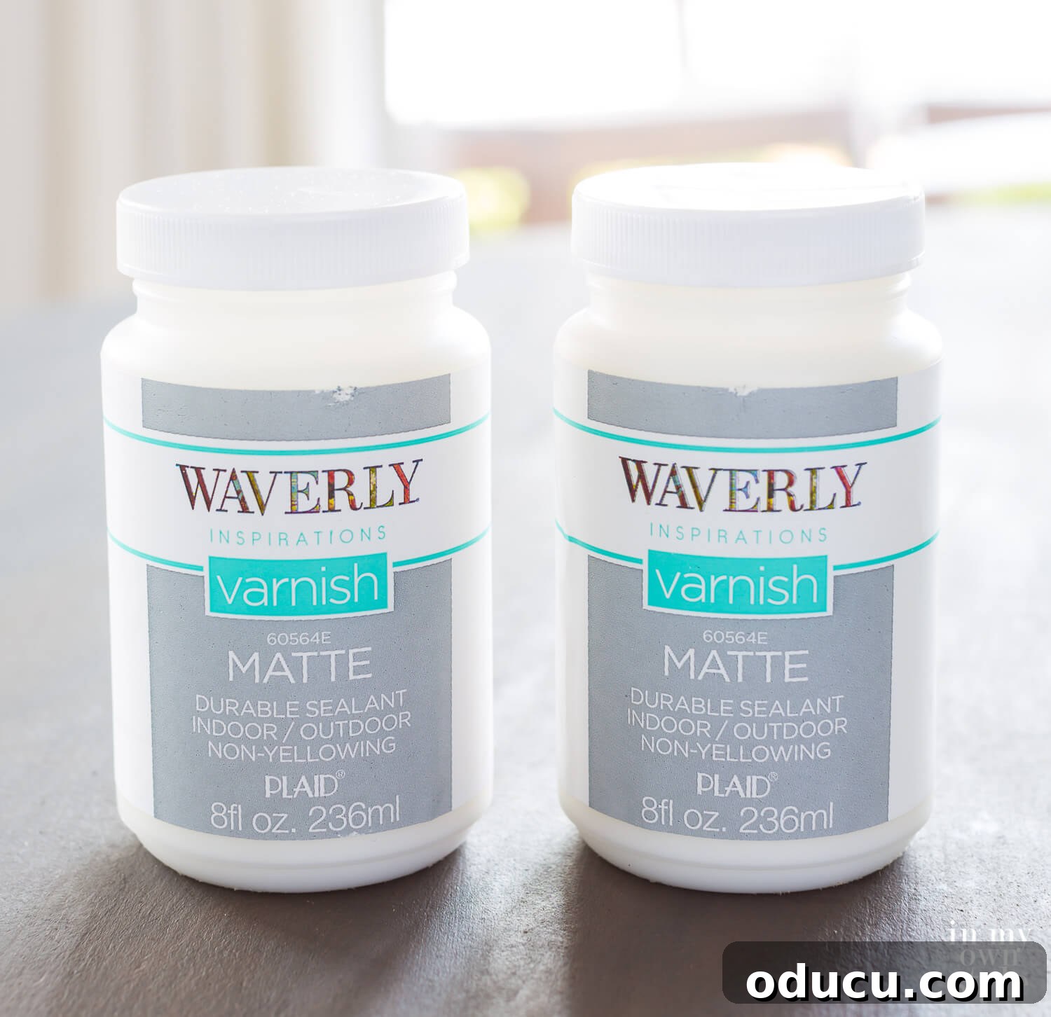 A can of Waverly Inspirations Matte Sealer, a protective topcoat option for faux painted surfaces like the zinc finish. This image illustrates a viable alternative to wax for durable table top protection, ideal for high-traffic areas.