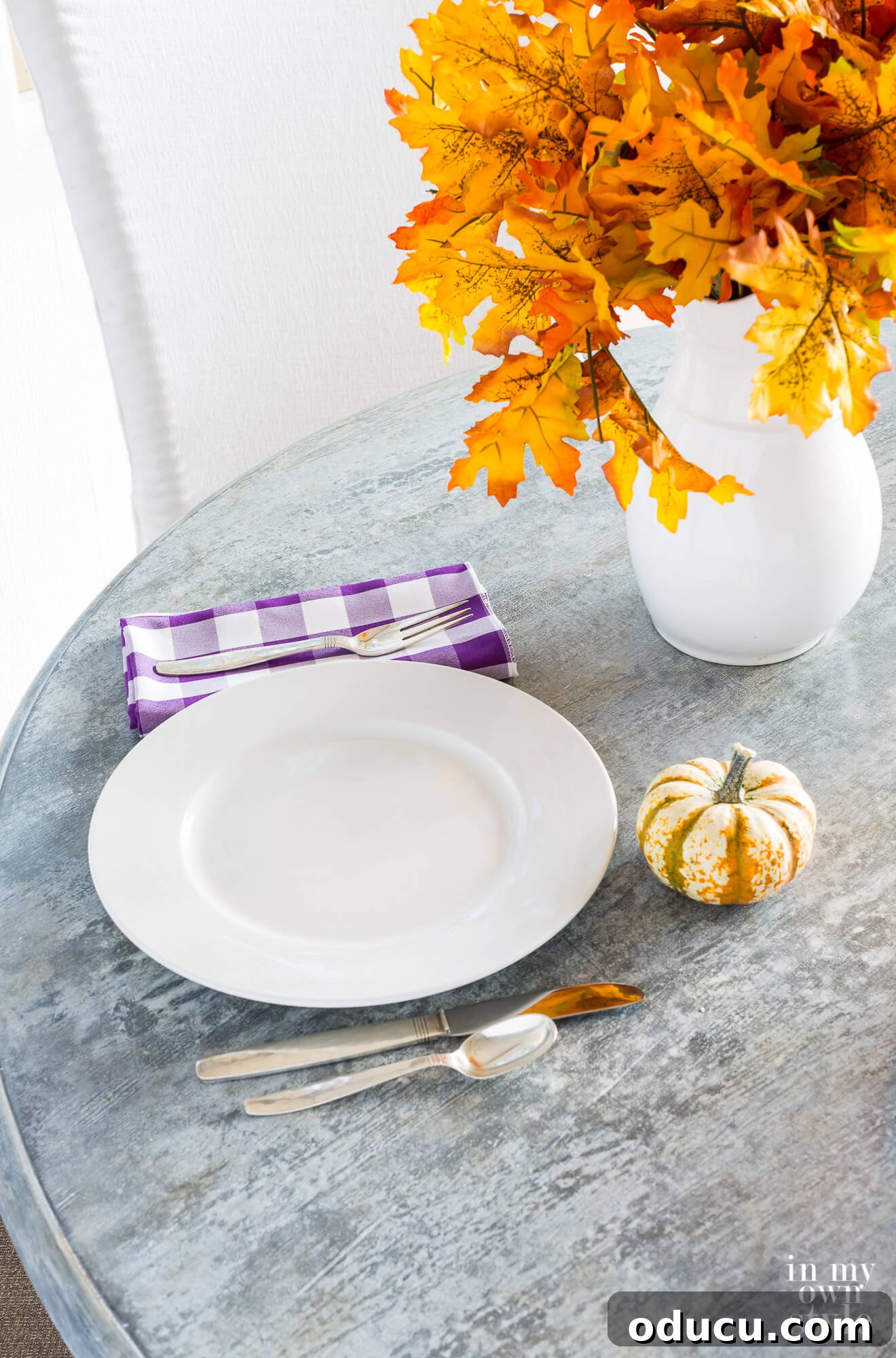 A beautifully finished faux zinc table top, showcasing the result of the painting and waxing tutorial. The surface has an authentic aged metal appearance, highlighting the success of the DIY decorative painting project.