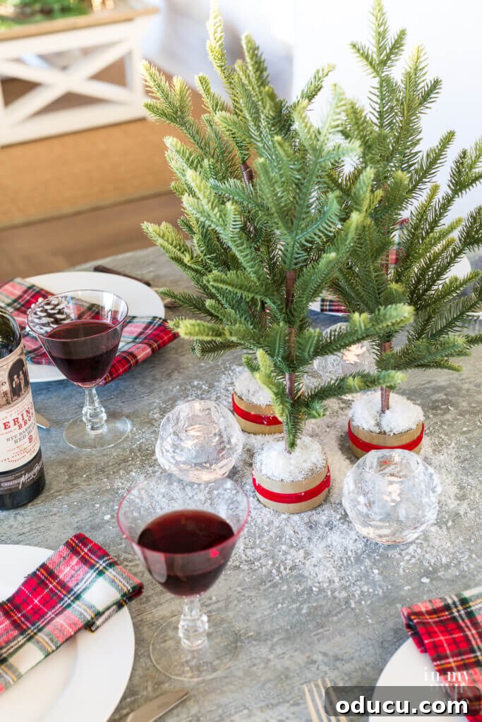 Effortless Festive Home Styling 25 A festive kitchen table setting adorned with traditional red and plaid accents, creating a warm and inviting atmosphere for Christmas dinner.