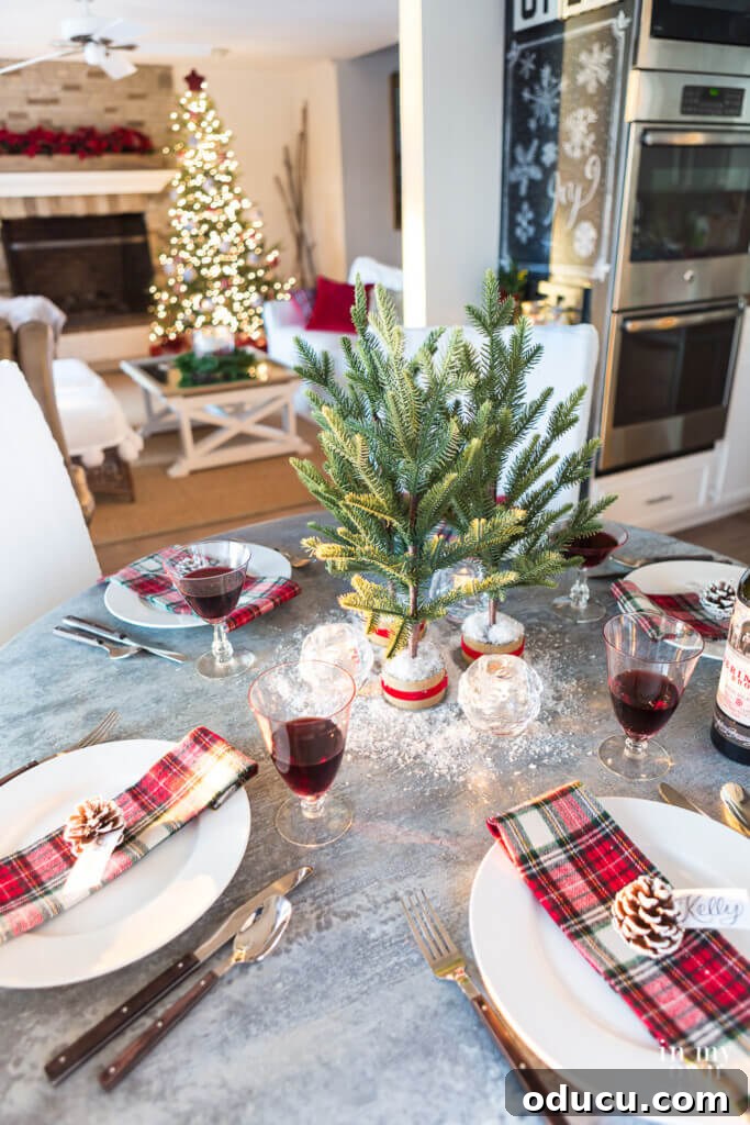 Effortless Festive Home Styling 27 A beautifully decorated kitchen and table setting, bathed in the warm glow of late afternoon sun, creating a magical Christmas dining atmosphere overlooking the lake.