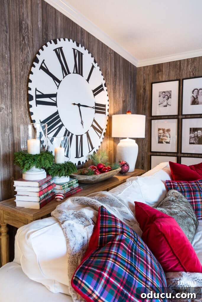 Effortless Festive Home Styling 9 A cozy living room, adorned with rustic red and plaid Christmas decor, creates a warm and inviting atmosphere for the holidays.