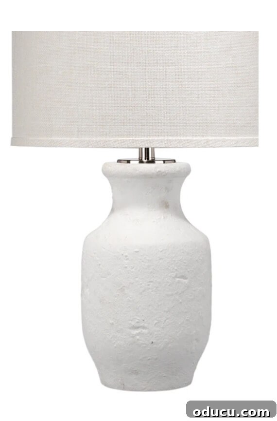 Thrifted Lamp Glow Up 3 An elegant white handcrafted ceramic lamp from McGee and Co, featuring a subtle texture and minimalist design.