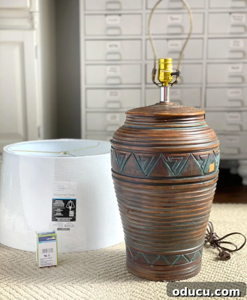 Thrifted Lamp Glow Up 4 An unappealing thrift store lamp with a dated design, before its transformative makeover, ready for upcycling.