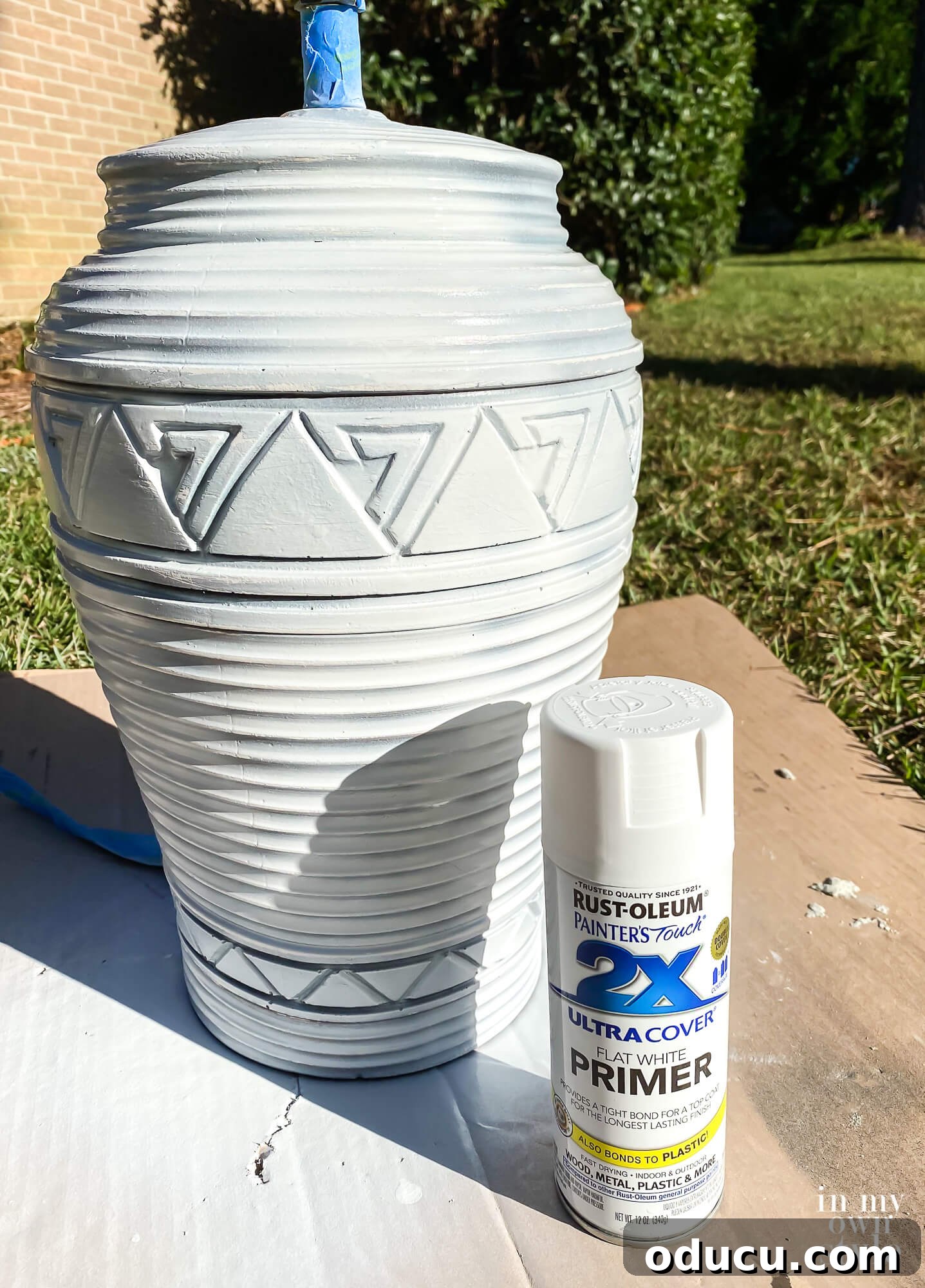 Thrifted Lamp Glow Up 6 How to spray paint a lamp base with primer for a DIY makeover. The lamp is being prepped for Spackle application.