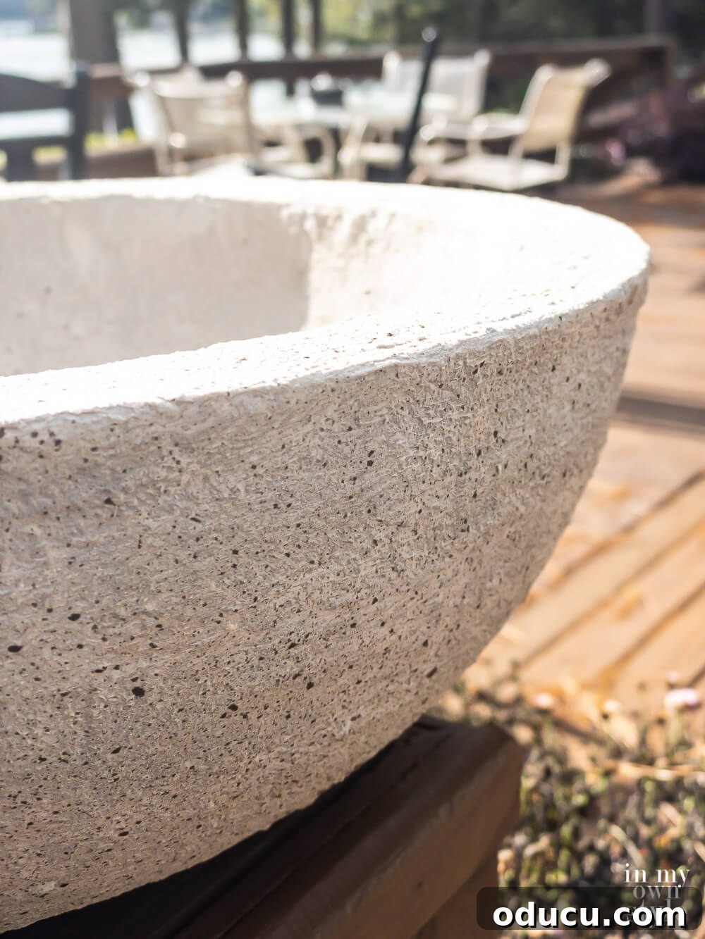 Close-up of the finished bowl, revealing the authentic texture created by splatters of grey-black paint, simulating natural stone imperfections.