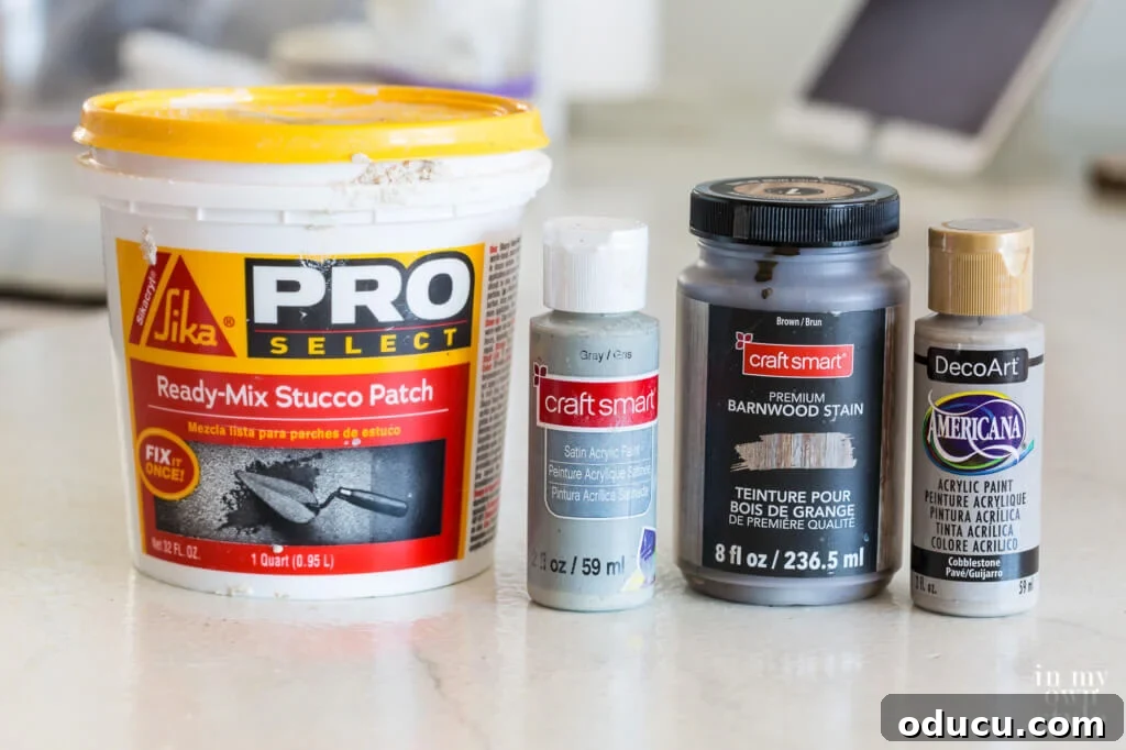 Various paints and materials used to give a dated planter a modern, trendy concrete-like finish.